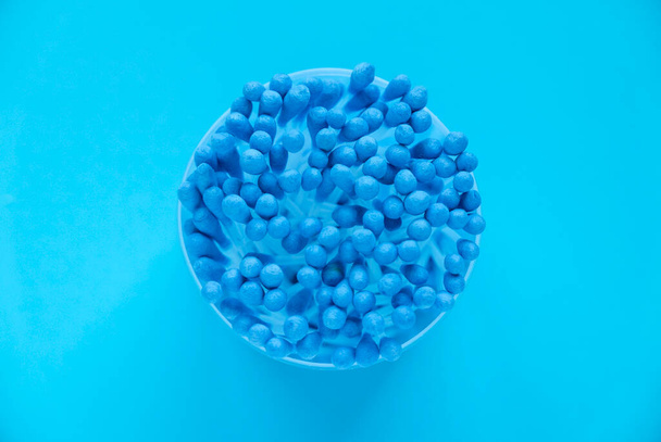Top view of cotton buds isolated on a blue background. - Photo, image