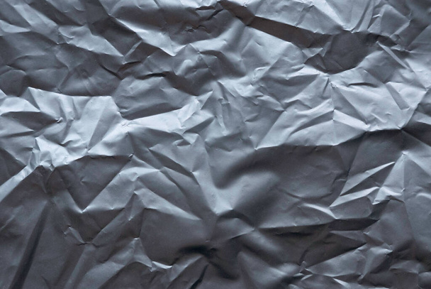 Green and crumpled plastic parcel bag background and texture. - Foto, imagen