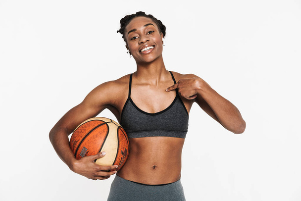 Black sportswoman with basketball pointing fingers at herself isolated over white background - Valokuva, kuva