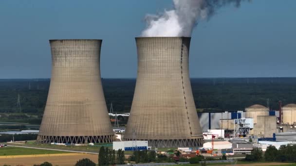 Aerial panoramic flight of around the nuclear power plant. Carbon dioxide emissions, energy of smoke and steam. Ecology and pollution of nature. High quality 4k footage - Felvétel, videó