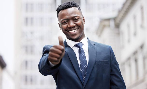 Early mornings get you the success you want. a young businessman showing a thumbs up in the city - Photo, image