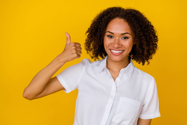Portrait of pretty satisfied lady arm finger demonstrate thumb up approval isolated on yellow color background. - Фото, зображення