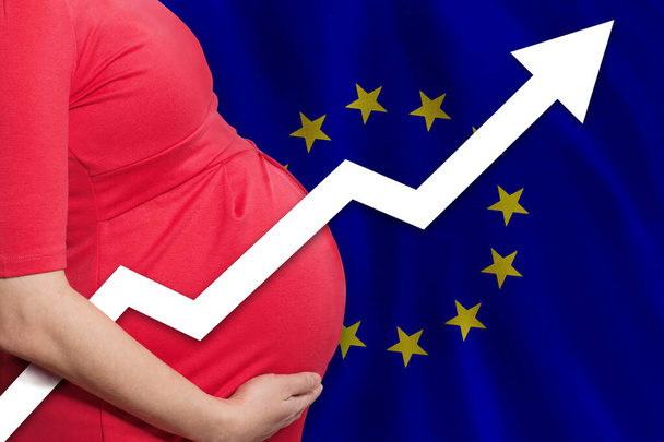 EU pregnant woman on flag of European Union background. Birth rate up - Foto, afbeelding