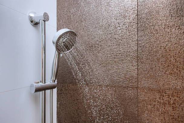 The very elegant stainless steel showerhead in the bathroom of the high quality shower head - Foto, Bild