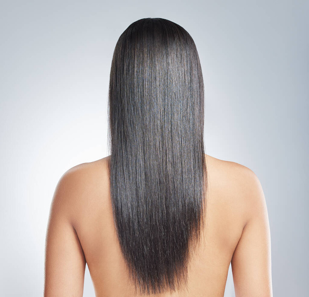 Do you see any split ends. an unrecognisable woman standing alone in the studio - 写真・画像