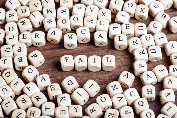 Word Fail in letters on cube dices on table. - Фото, изображение