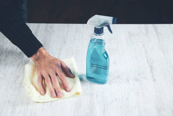 man cleaning cloth on desk background - Photo, image