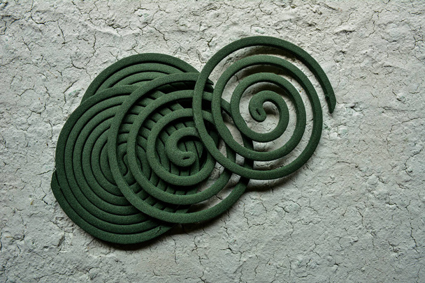 Mosquito coil burning to prevent bugs from bothering campers.Smoking aromatic spiral fighting mosquitoes and midges - Foto, immagini