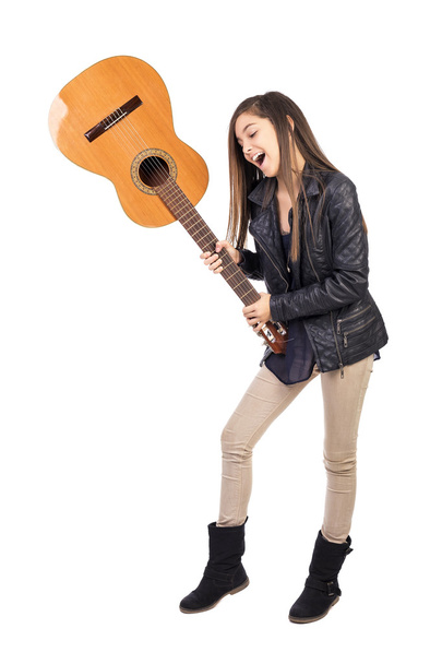 Pretty girl throwing her guitar - Фото, зображення