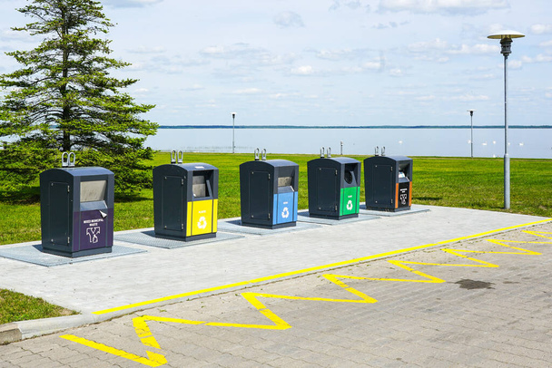 Five new containers for different waste sorting in the city square by the sea - Foto, Imagen
