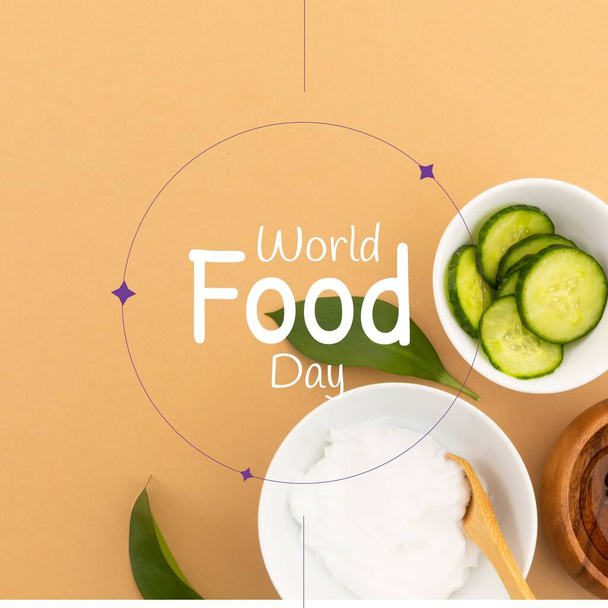 Image of world food day over bowls with cheese and cucumbers. Food, nutrition, agriculture, health and food production concept. - Photo, Image