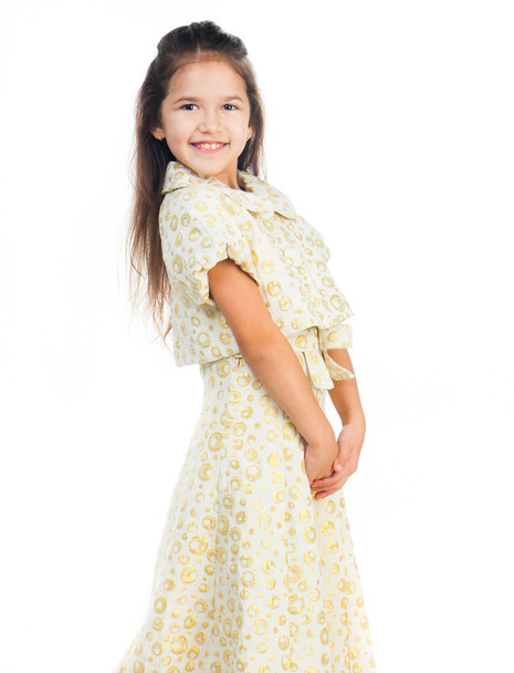 Cute little girl in a light dress - Fotó, kép