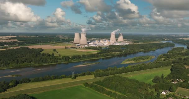 Aerial view to nuclear power plant in France. Atomic power stations are very important sources of electricity with low carbon footprint. Aerial view to big source of emissions in European Union. - Séquence, vidéo