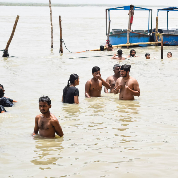 Garh Mukteshwar, Uttar Pradesh, India - June 11 2022 - People are taking holy dip on the occasion of Nirjala Ekadashi, A view of Garh Ganga Brij ghat which is very famous religious place for Hindus - Photo, image