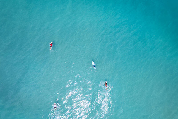Surfers in the blue ocean top view Beautiful sea in summer season at Phuket Thailand - Фото, изображение