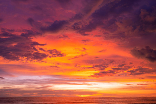 Nature beautiful Light Sunset or sunrise over sea Colorful dramatic majestic scenery Sky with Amazing clouds and waves in sunset sky golden light cloud - Photo, image