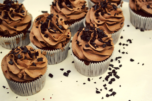 Chocolate cupcakes with brown cream - Photo, Image