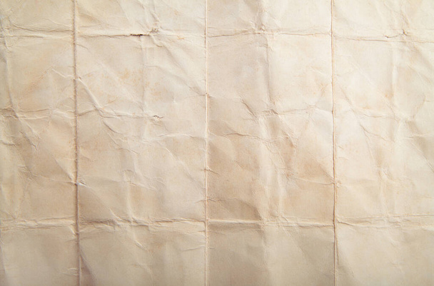 Pale old yellow paper background texture. Rough light brown kraft paper with pulp texture for background. High resolution texture backdrop. Crumpled paper. - Foto, imagen