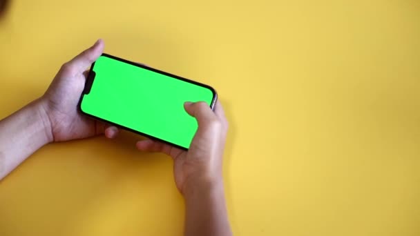 Child Using Phone With Green Mock-up. Surfing Internet Watching Content Videos Blogs Learning. boy Playing Video Games. chroma key for copy space. Slow motion. - 映像、動画
