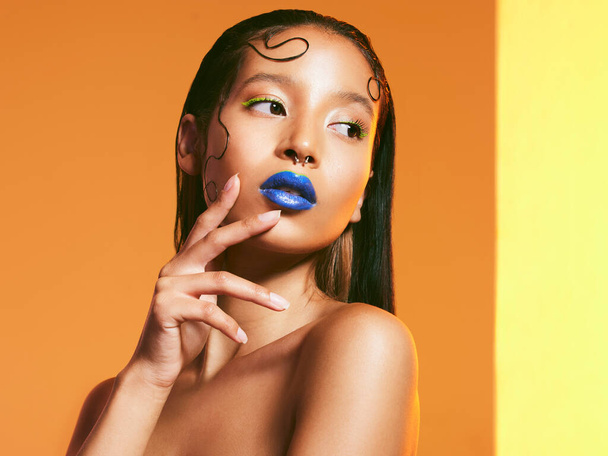 Nobodys opinion but yours should matter. Studio shot of a beautiful young woman wearing blue lipstick - 写真・画像