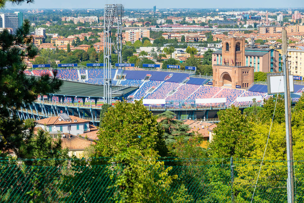 A beautiful view of the Stadio Renato Dall'Ara through trees with the city in the background - Foto, immagini