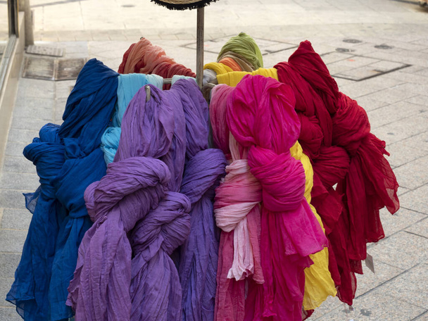 many different colors scarfes at the market detail - Φωτογραφία, εικόνα