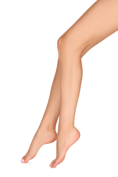 Woman with beautiful long legs on white background, closeup - Фото, зображення