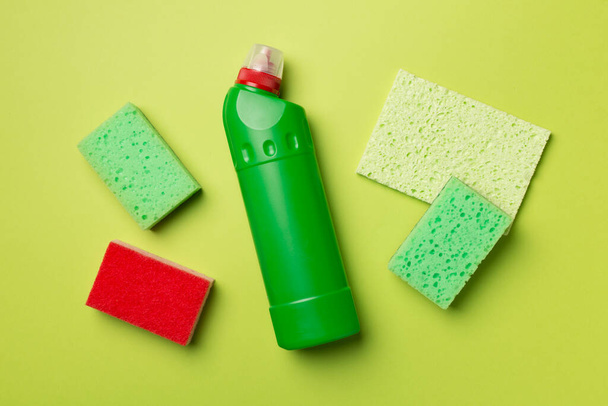House cleaning products on color background, top view. - Фото, изображение
