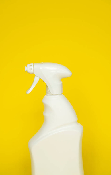 White blank plastic spray detergent isolated on yellow background. Packaging template mockup - Valokuva, kuva