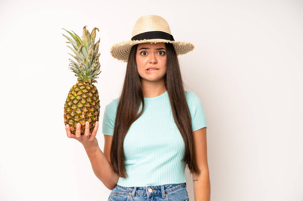 hispanic pretty woma looking serious showing open palm making stop gesture. pineapple and summer concept - Foto, Imagem