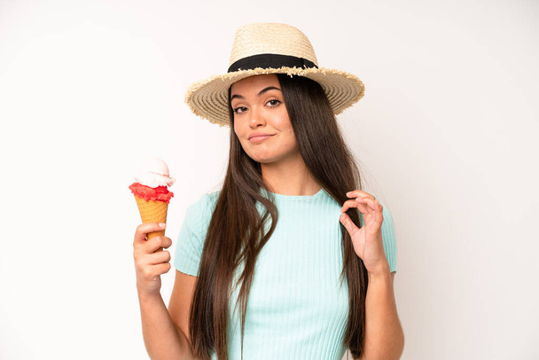 hispanic pretty woma smiling happily and daydreaming or doubting. ice cream and summer concept - Fotografie, Obrázek