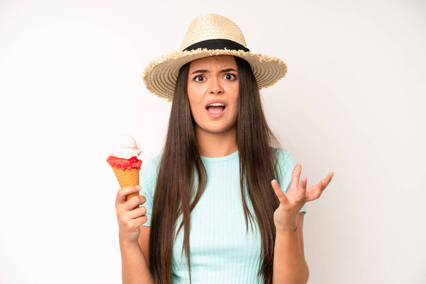 hispanic pretty woma smiling happily with friendly and  offering and showing a concept. ice cream and summer concept - Foto, immagini