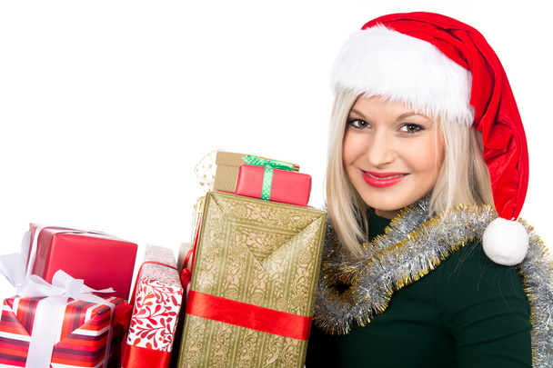 Beautiful christmas woman is holding gift in studio. Isolated  - Φωτογραφία, εικόνα