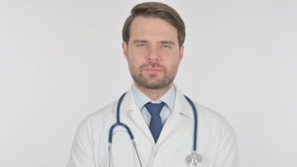 Smiling Young Adult Doctor on White Background  - Filmagem, Vídeo