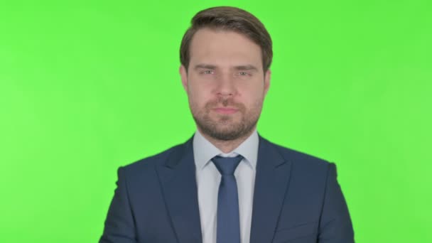 Young Adult Businessman in Denial on Green Background  - Video