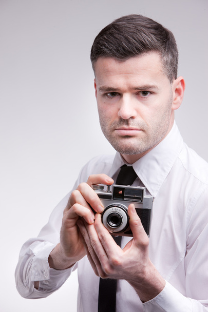 photographer with an oldstyle analogue photocamera shooting phot - 写真・画像