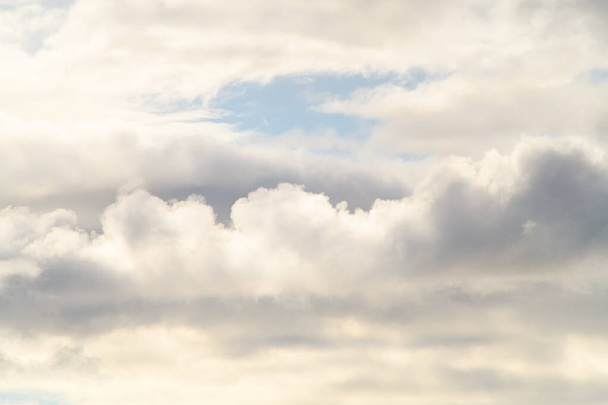 view of white and grey thick cumulus clouds on blue sky. Beautiful cloud landscape. Nature concept - Fotó, kép