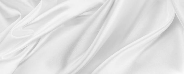 波打つような白い絹織物の質感のクローズアップ背景 - 写真・画像