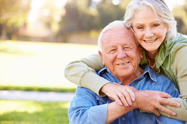 Outdoor Portrait Of Loving Senior Couple - Foto, Imagen