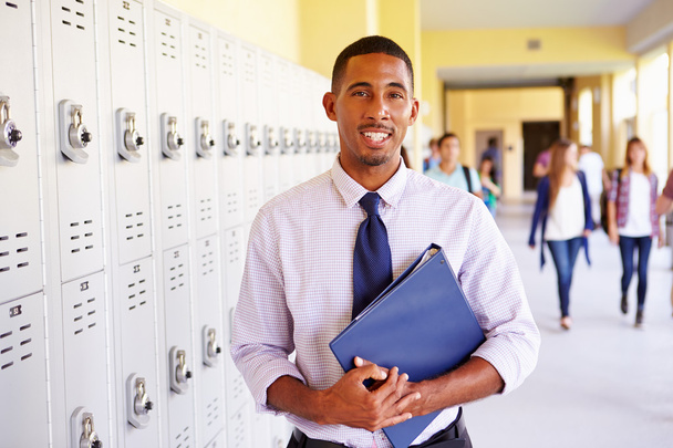 Male Teacher Standing By Lockers - Photo, Image