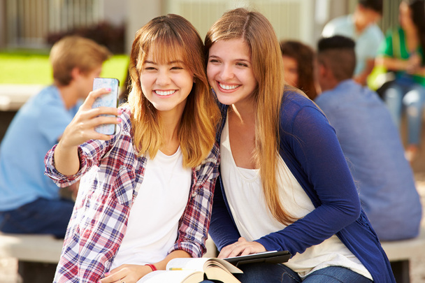 Female Students Taking Selfie On Campus - Photo, image