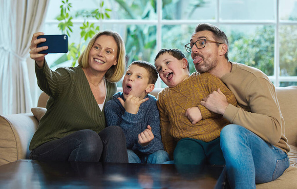 I love you all so much. a family taking a selfie using a smartphone - Photo, Image