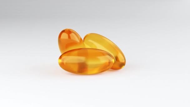 Soft gelatin capsules for containing oily drugs and nutritional supplements like vitamin A, and E. 3D rendering motion. Falling Omega-3 fish oil liquid gel capsules falling over white background - Video