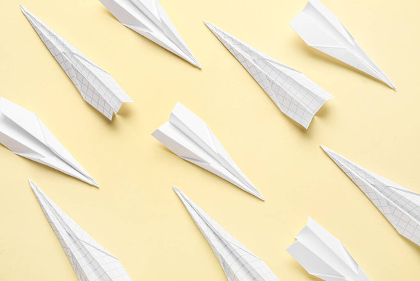 Paper planes on yellow background - Фото, изображение