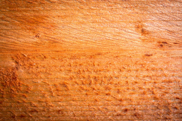 Orange painted wooden board with texture. Scabs and branches. - Foto, Imagen