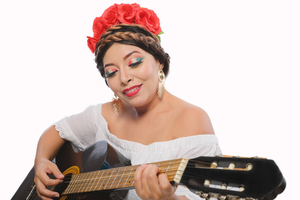 Mexican woman made up with Mexican flag colors wearing white dress. Mexican woman with guitar on white background. - Fotoğraf, Görsel