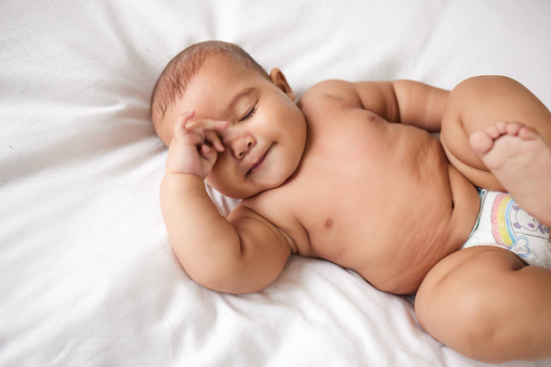 The most beautiful miracle in life. an adorable baby boy on the bed at home - Foto, immagini