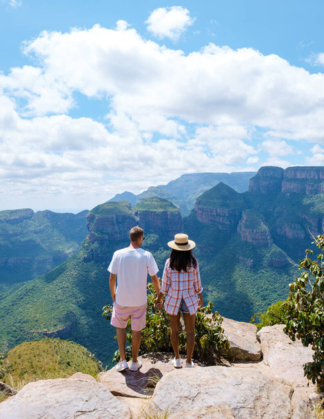Panorama Route South Africa, Blyde river canyon with the three rondavels, view of three rondavels and the Blyde river canyon in South Africa. Asian women and Caucasian men on vacation in South Africa - Foto, Imagen