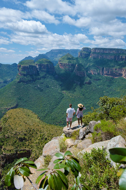 Panorama Route South Africa, Blyde river canyon with the three rondavels, view of three rondavels and the Blyde river canyon in South Africa. Asian women and Caucasian men on vacation in South Africa - Foto, immagini