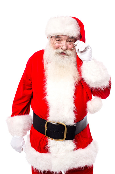Santa Claus adjusting spectacles - Foto, afbeelding